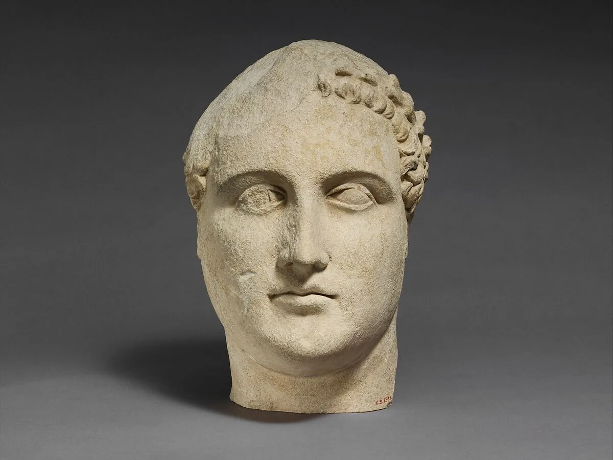 Limestone head of a beardless male votary — Unknown