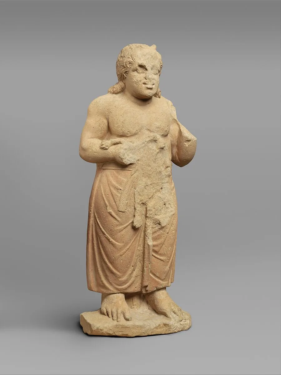 Limestone statue of a god — Unknown
