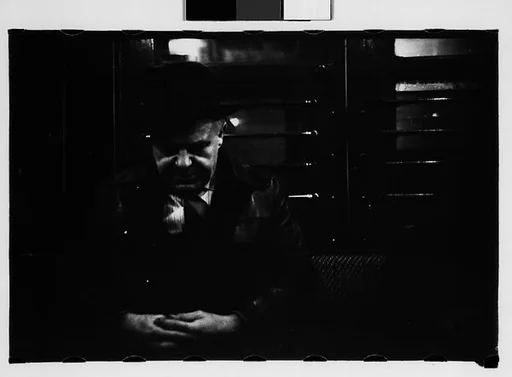 [Five 35mm Film Frames: Subway Passengers, New York City: Sleeping Man with Clasped Hands]