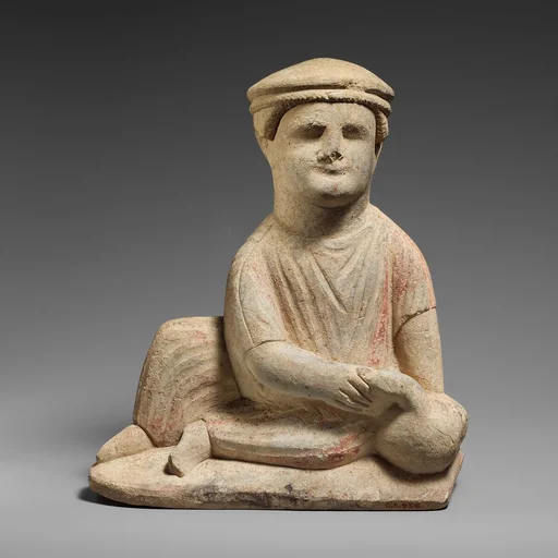 Limestone statuette of a temple boy