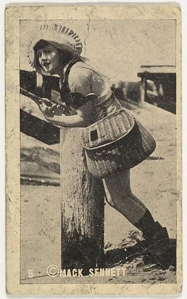 Card 5, Actress wearing bonnet and wicker bag leaning on wooden post, from the Movie Stars series (T124), issued by John J. Bagley & Co. to promote Buckingham Cigarettes — Mack Sennett|John J. Bagley & Co.