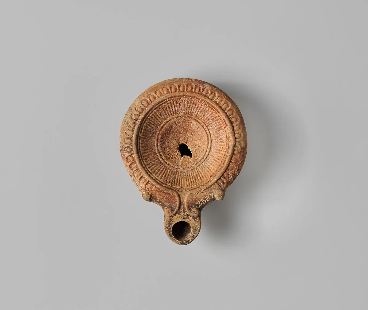 Terracotta oil lamp — Unknown