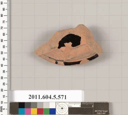 Terracotta fragment of a stemless kylix (drinking cup)