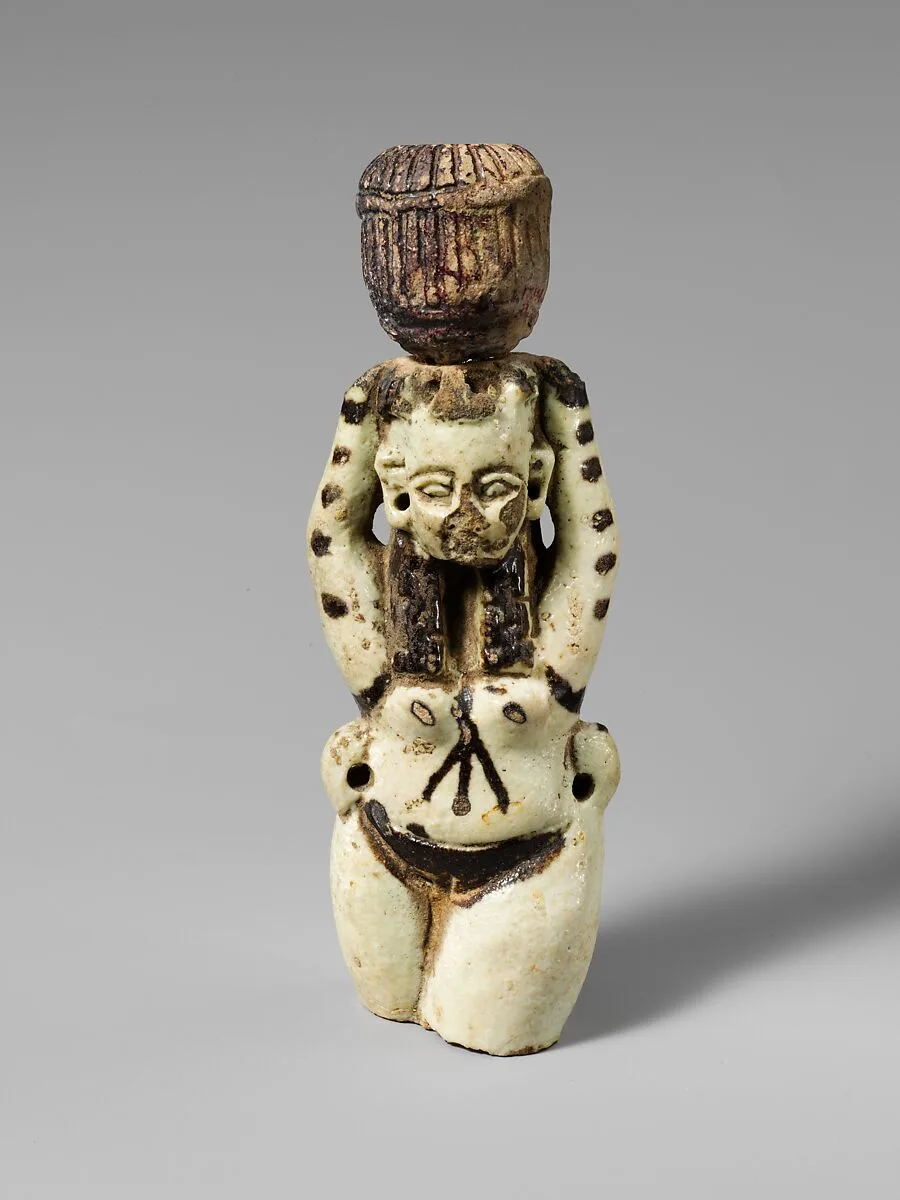 Fragment of a faience statuette of a woman holding a vase on her head — Unknown