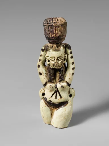Fragment of a faience statuette of a woman holding a vase on her head