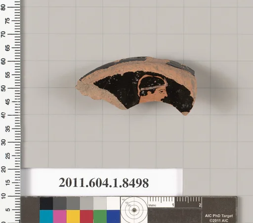 Terracotta fragment of a stemless kylix (drinking cup)