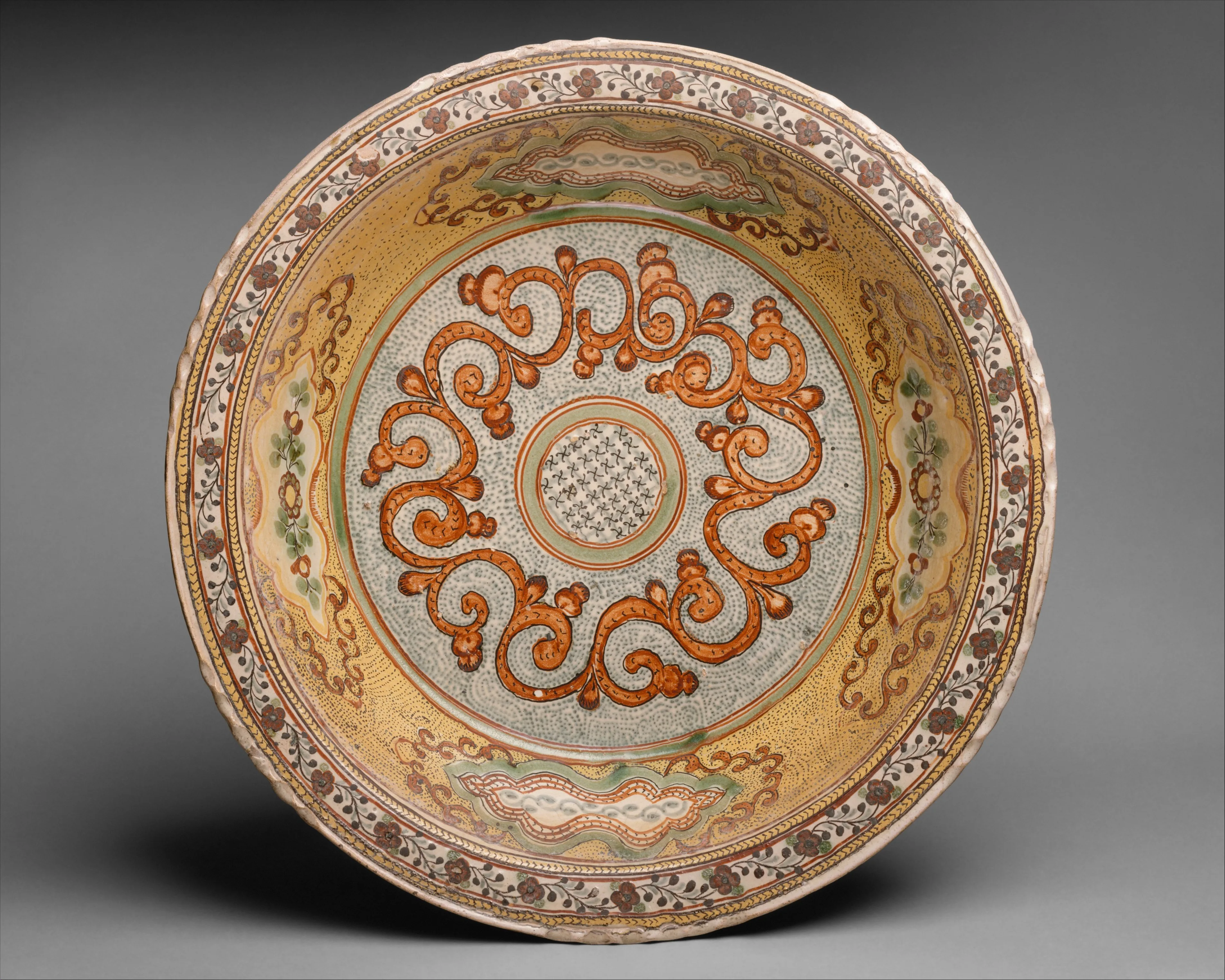 basin with polychrome scroll motif on strippled ground — Unknown