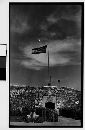 [Flag, Wall, and Cannon of El Castillo de San Salvador de la Punta Fortress, Havana, Cuba]