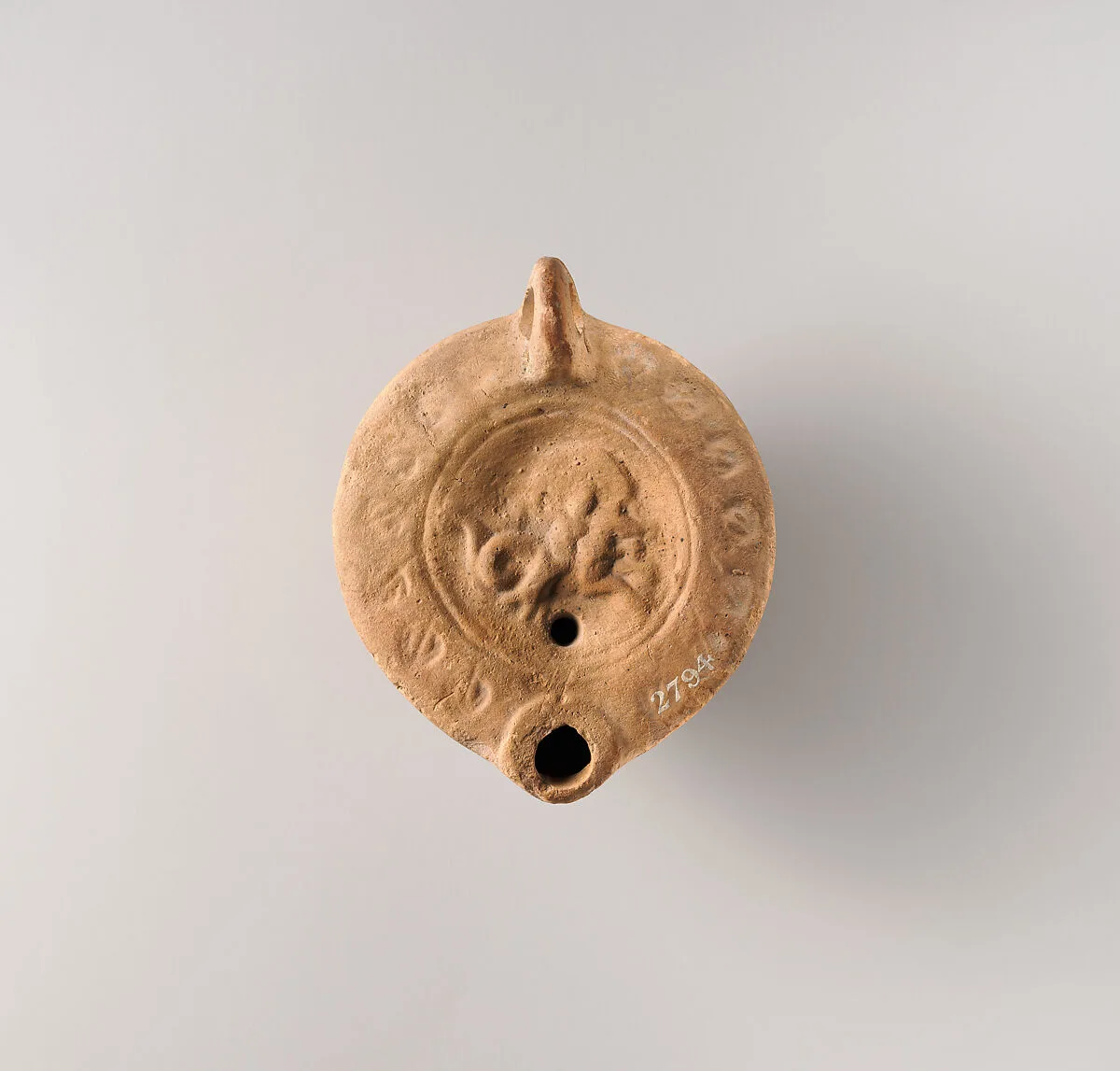 Terracotta oil lamp — Unknown