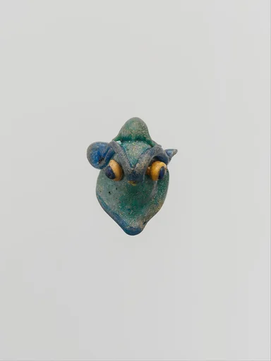 Glass pendant in the form of a demonic mask