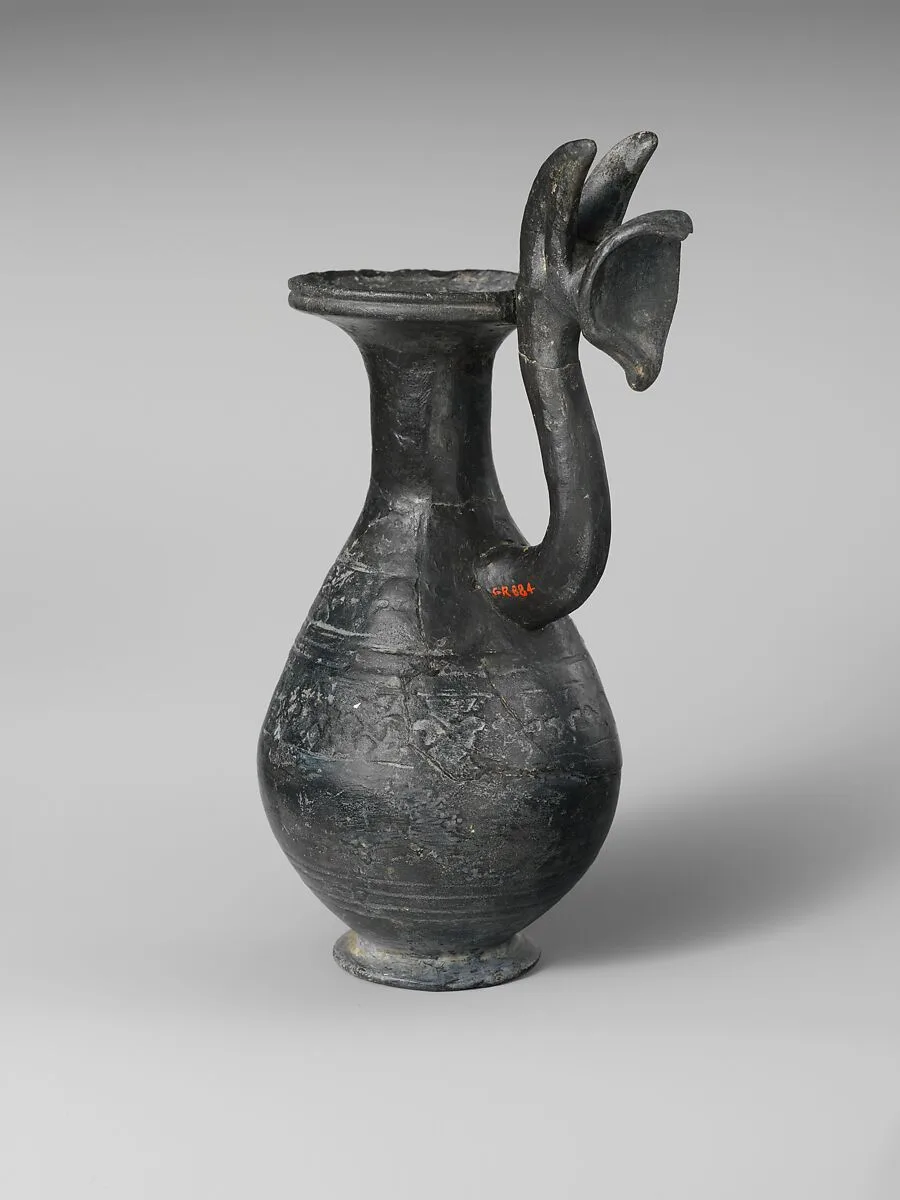 Terracotta jug with griffin protome handle — Unknown