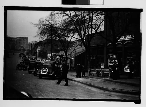 [Parked Cars and Pedestrian Crossing Main Street, Milledgeville, Georgia]
