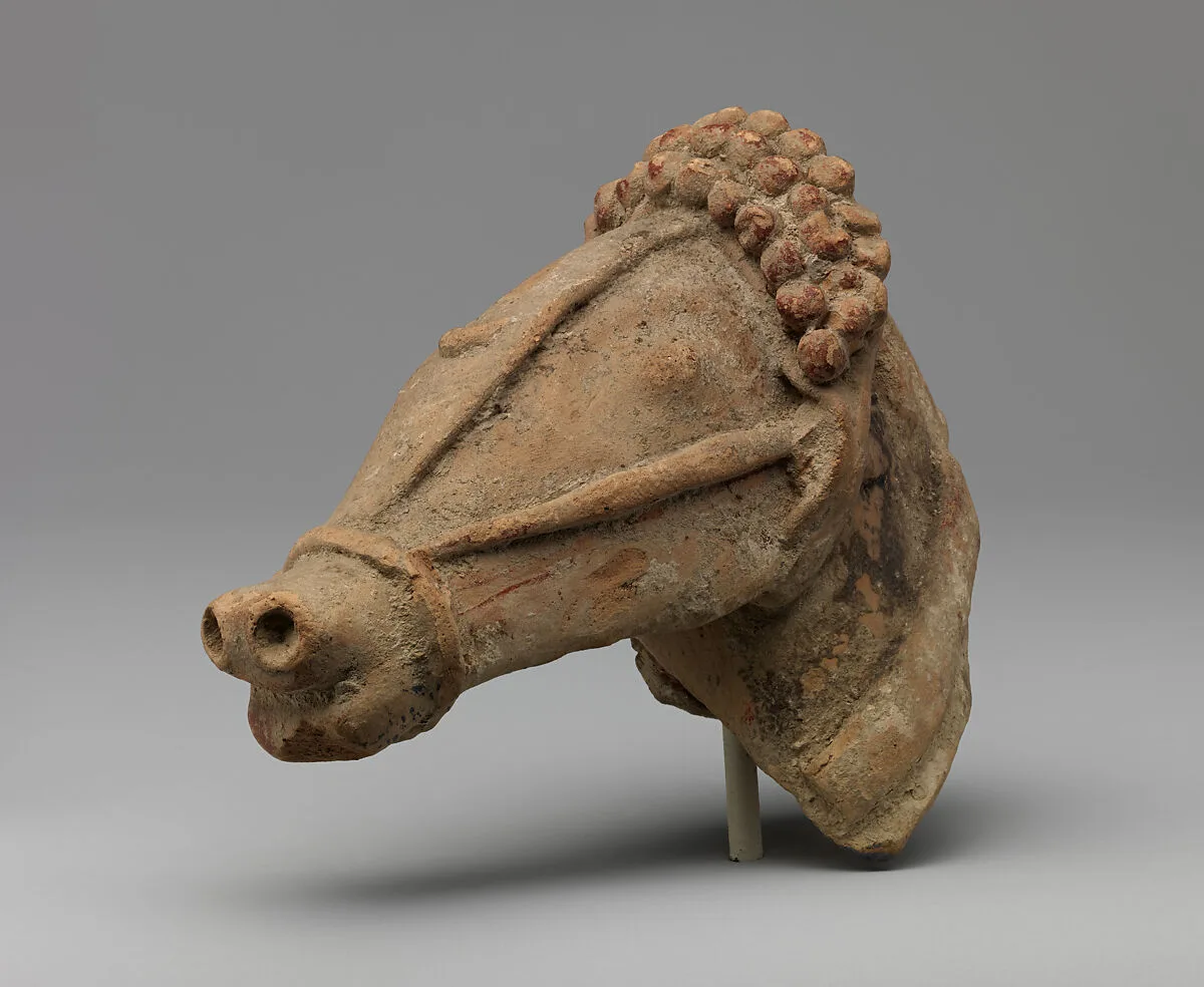 Terracotta horse's head with harness — Unknown