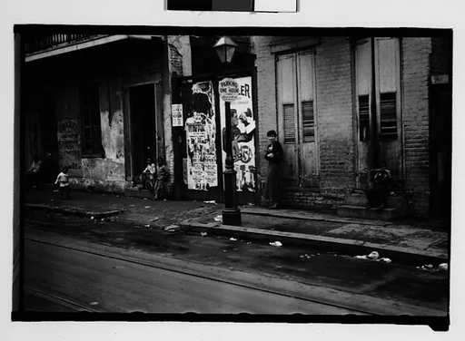 [Shuttered House Façade with People on Balconies in French Quarter, New Orleans, Louisiana]