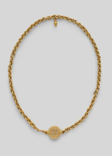 Necklace with ornate clasp ornament and a small drop pendant
