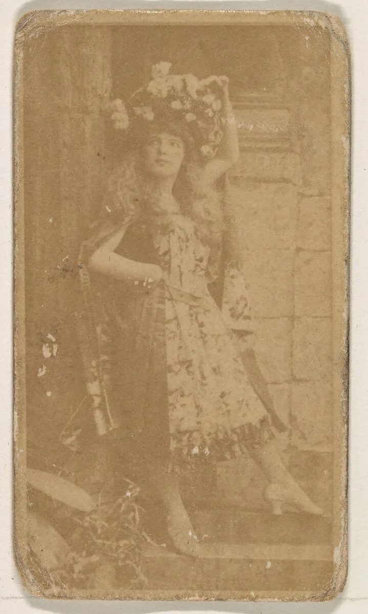 Actress wearing large floral piece in hair, from the Actresses series (N245) issued by Kinney Brothers to promote Sweet Caporal Cigarettes — Kinney Brothers Tobacco Company