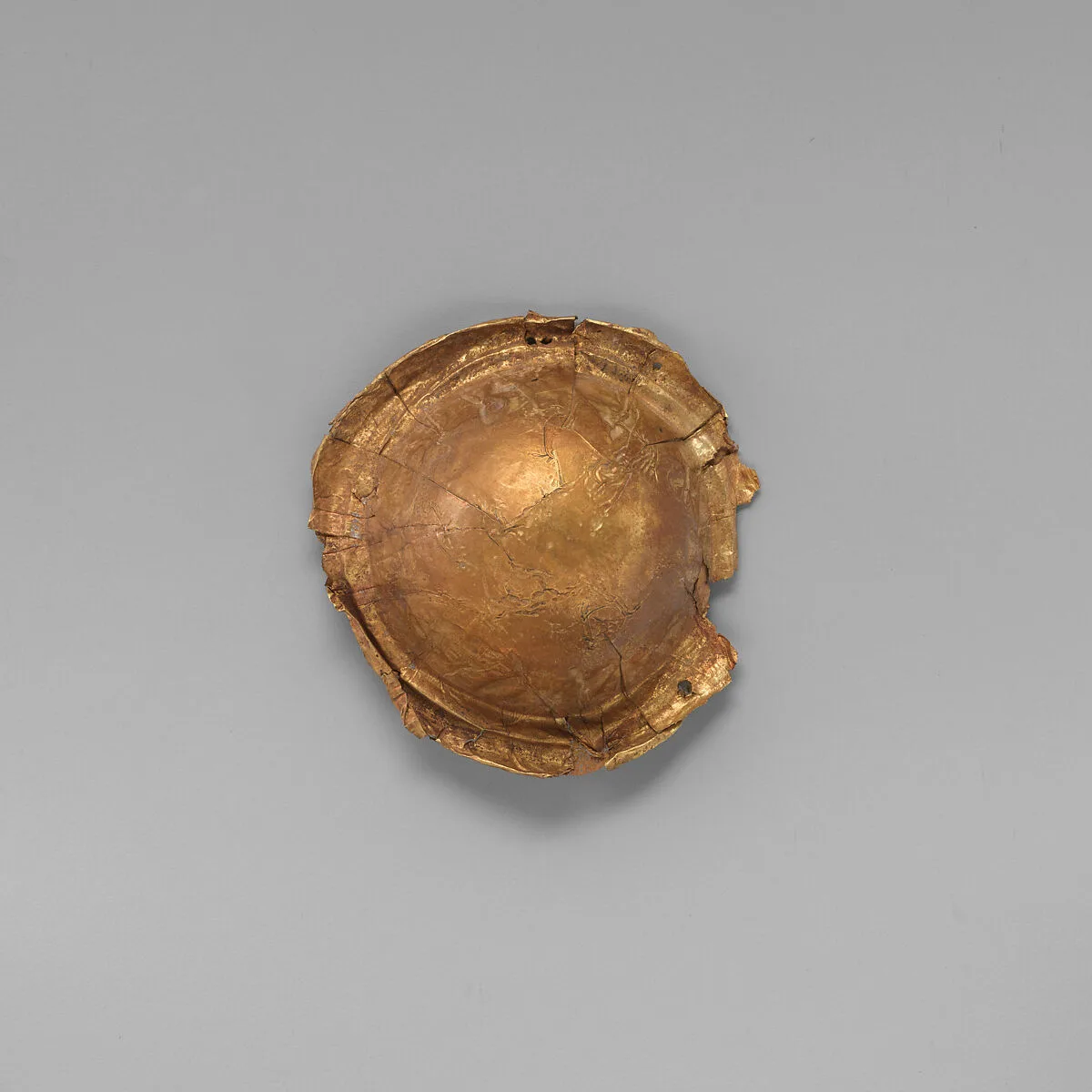 Gold roundel of bulbous form — Unknown