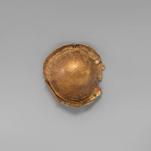 Gold roundel of bulbous form
