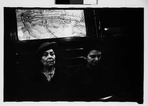 [Four 35mm Film Frames: Subway Passengers, New York City: Two Women, Women Beneath "Lex Ave Local" Sign]