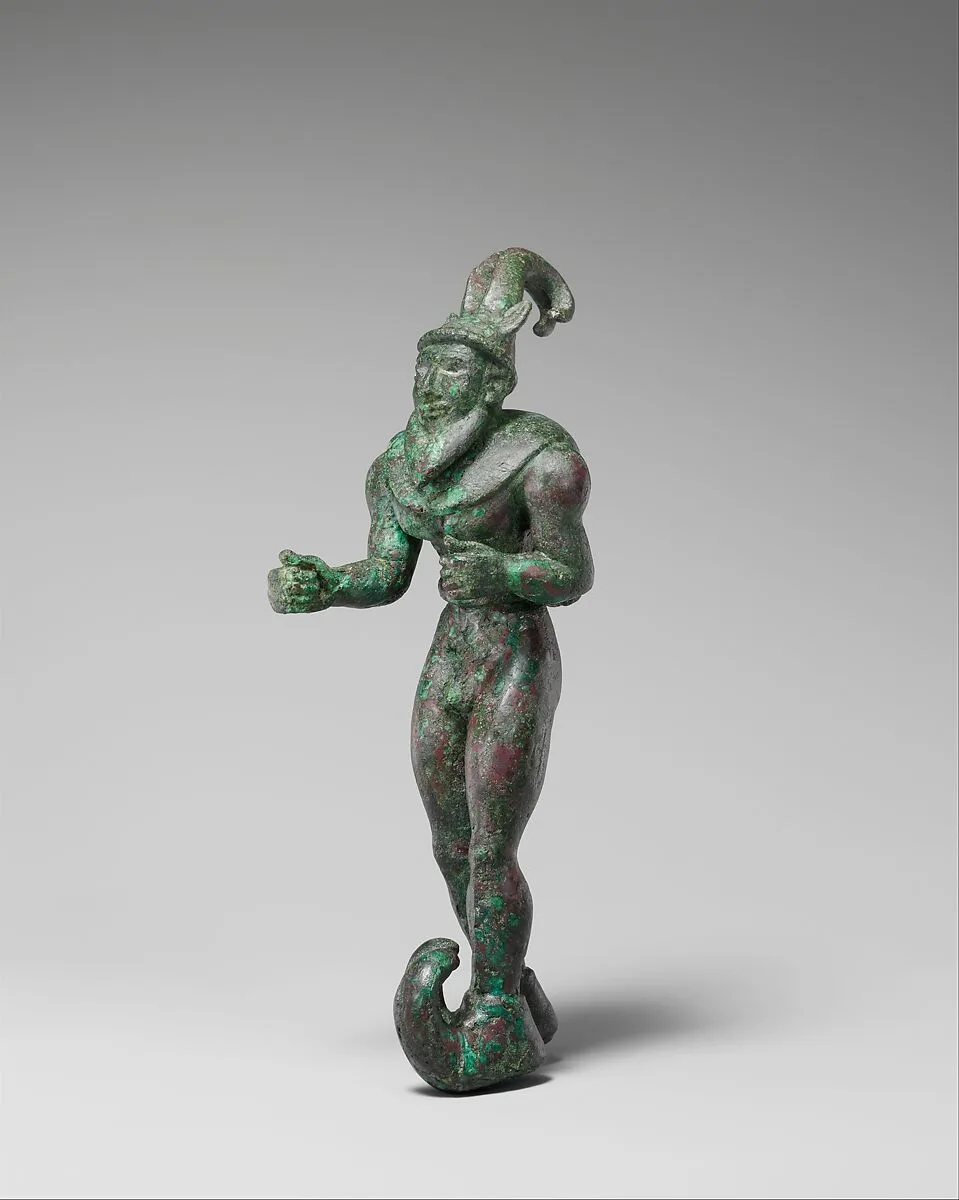 Striding figure with ibex horns, a raptor skin draped around the shoulders, and upturned boots — Unknown