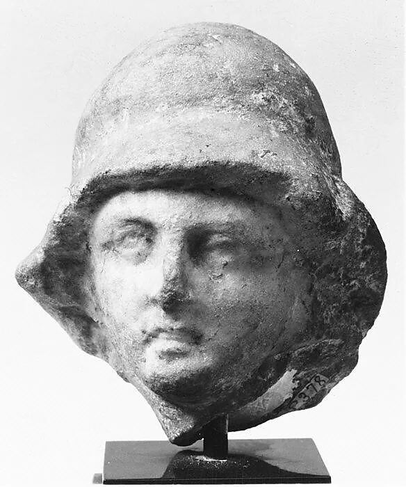 Small helmeted head from a marble relief — Unknown