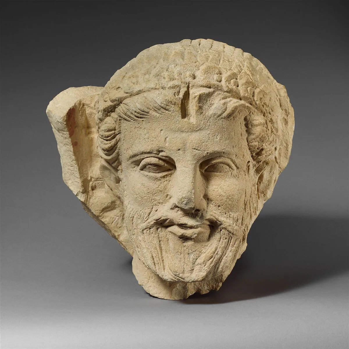 Limestone head of a bearded man from a funerary stele — Unknown