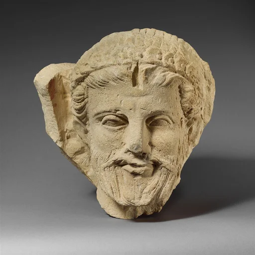 Limestone head of a bearded man from a funerary stele