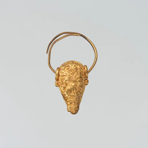 Gold earring with head of a bull