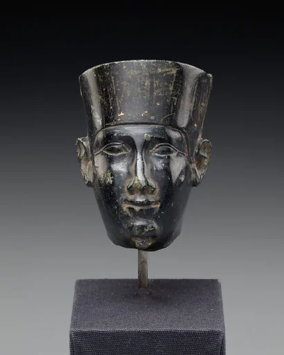Head from a small statuette, possibly of Min