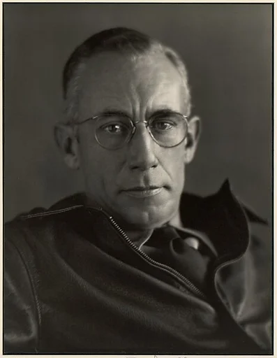 [Man with Wire-rimmed Glasses]