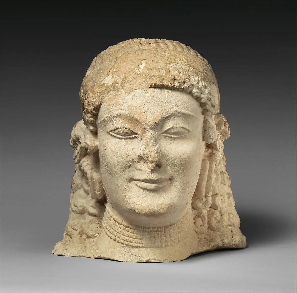 Limestone female head — Unknown