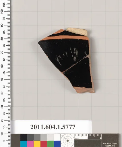 Terracotta fragment of a kylix: eye-cup (drinking cup)