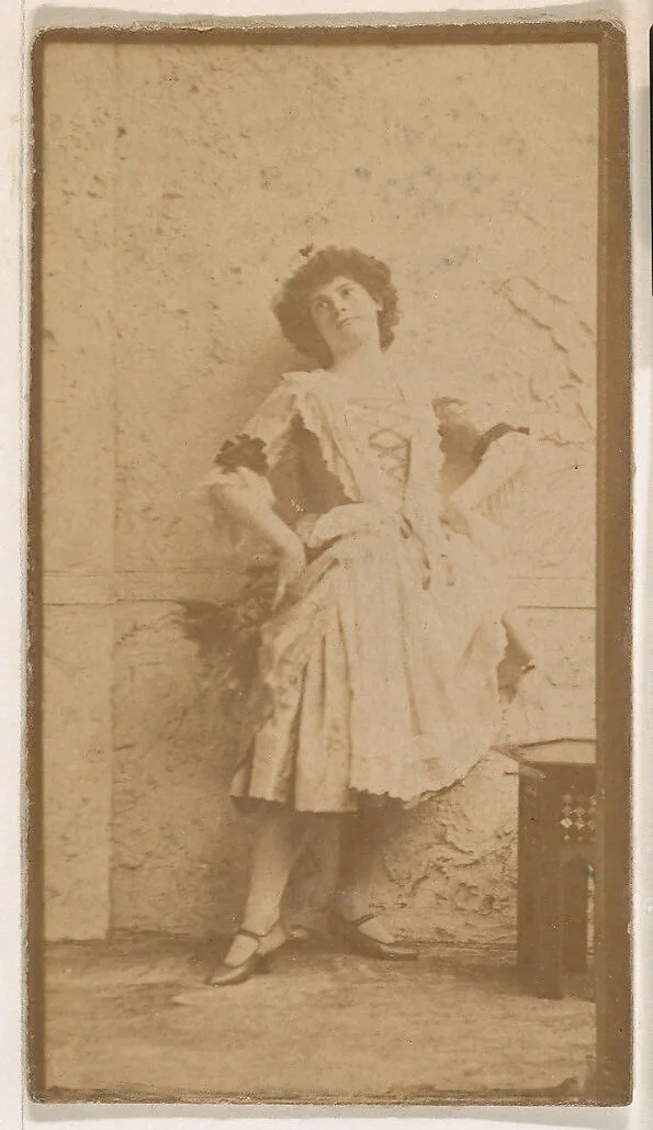 Actress leaning against wall, from the Actresses series (N664) promoting Old Fashion Fine Cut Tobacco — Unknown