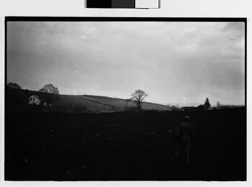 [Two 35mm Film Frames: Farmer in Field, Copake, New York]
