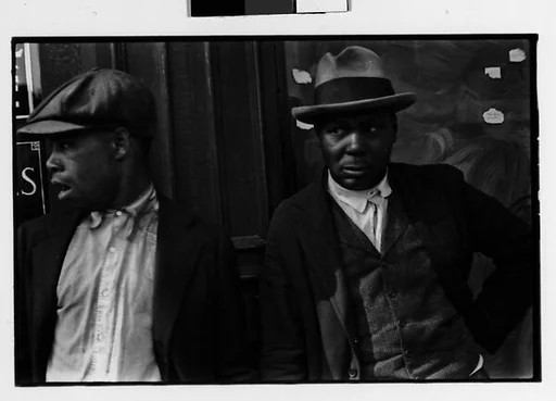 [Two 35mm Film Frames: Two Men on Street]