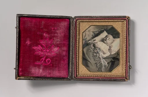 [Postmortem Baby, Partially Covered by a Flowered Shawl with a Fringe Hem]