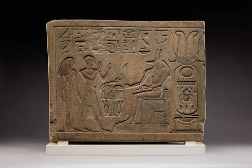Stela of Siamun and Taruy worshipping Anubis