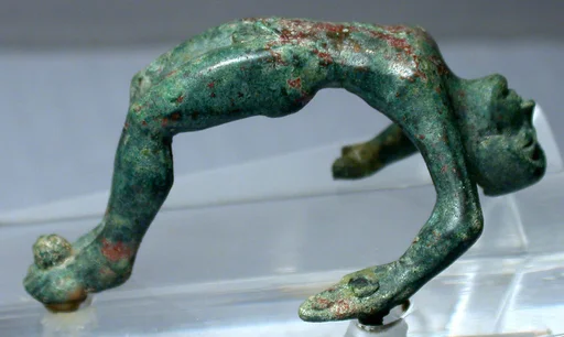 Bronze handle of a cista with nude youth