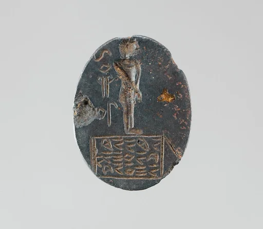 Haematite intaglio: Youth on inscribed stele