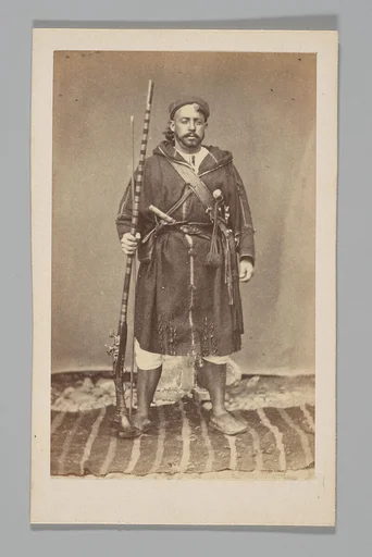 [Studio Portrait: Man with Gun, Algeria]