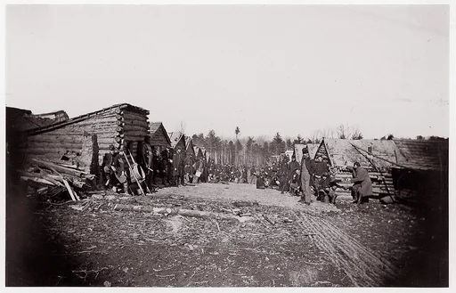 [Winter Quarters of Unidentified Union Army Regiment with Two Rows of Log Cabins]