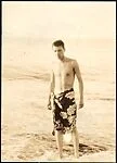[South Seas: Walker Evans in Sarong on Beach]