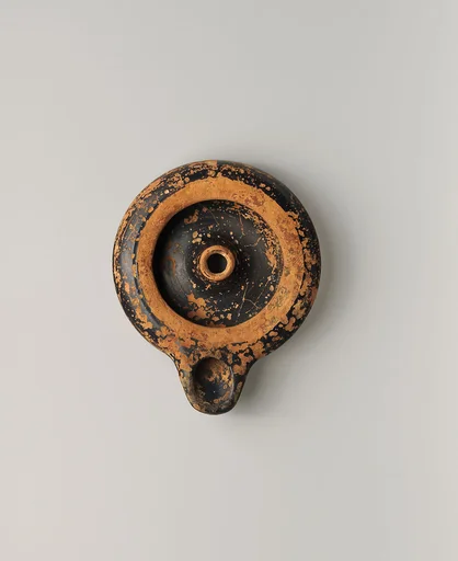 Terracotta oil lamp