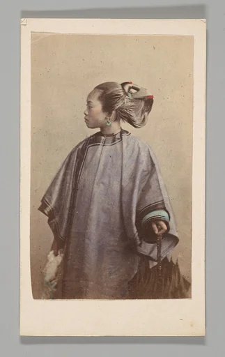 [Studio Portrait: Woman Standing in Profile Holding Umbrella, Hong Kong]