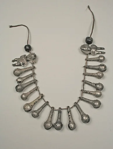 Necklace with bells and two figures