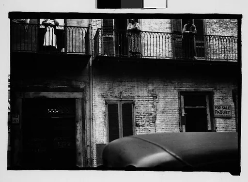 [People on Balconies of Shuttered Houses in French Quarter, New Orleans, Louisiana]