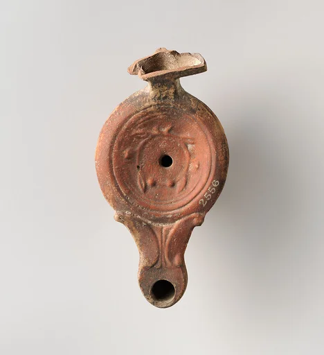 Terracotta oil lamp