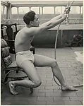 [Male Model Posed Pulling a Rope in Anna Huntington's Rooftop Studio]