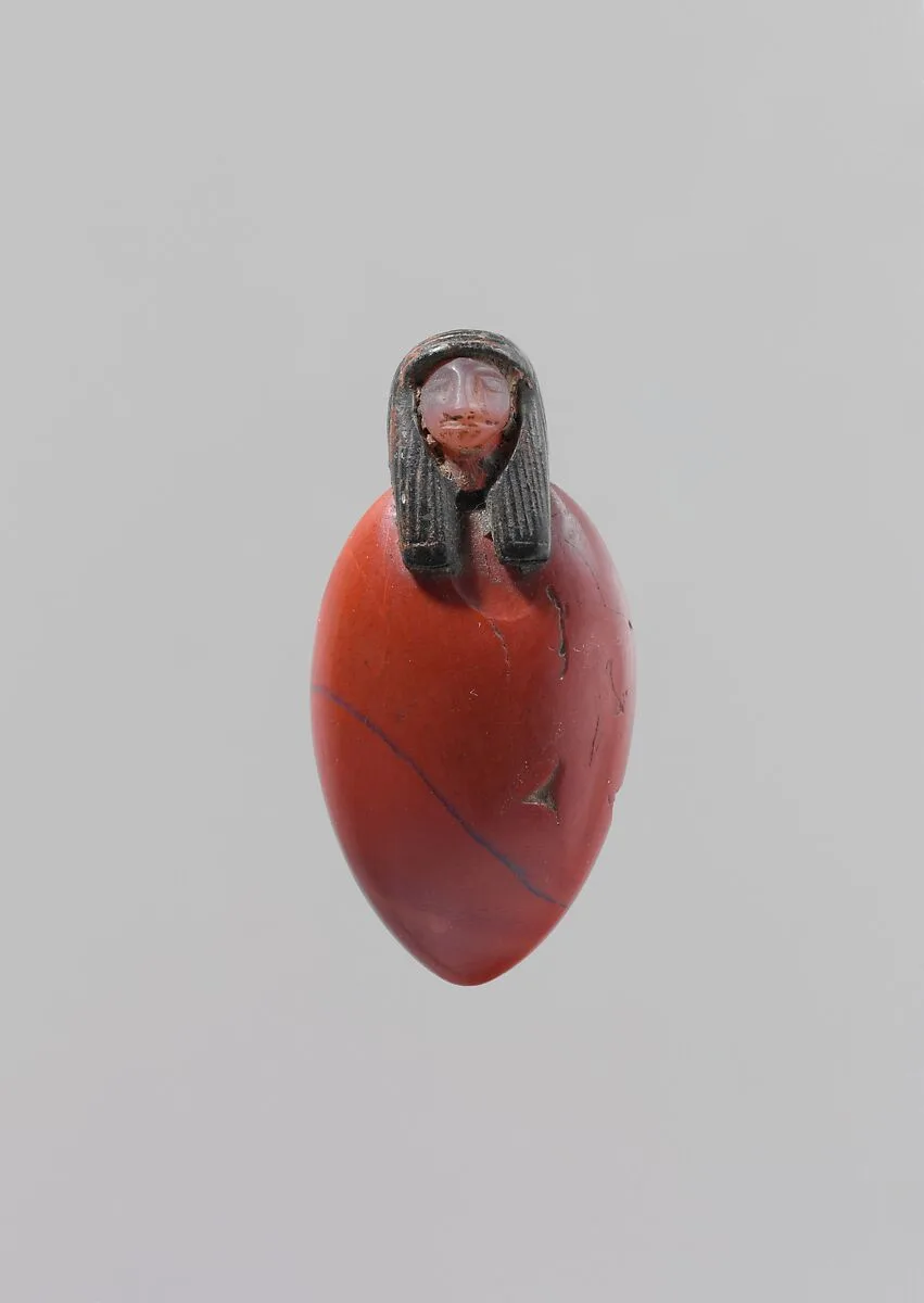 Heart amulet with human head — Unknown