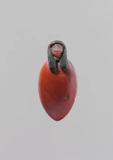 Heart amulet with human head
